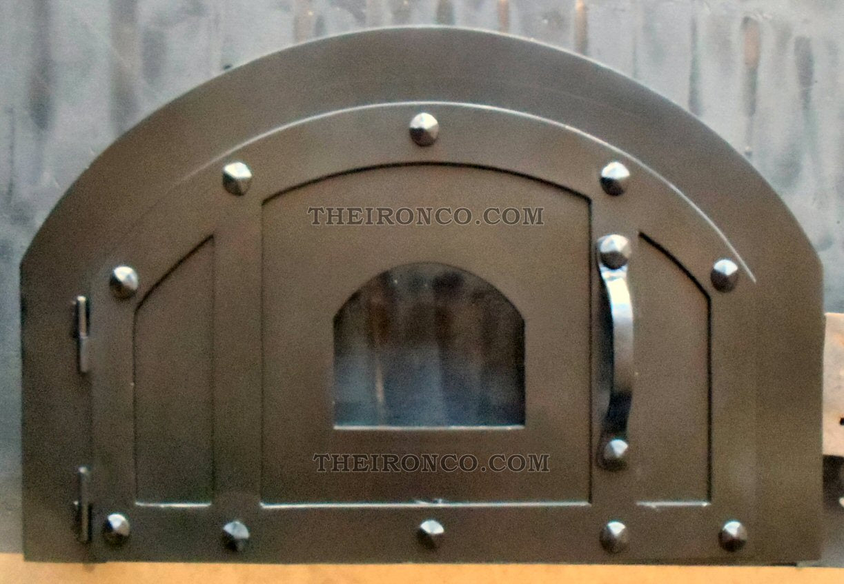 traditional style iron pizza oven door with rivets