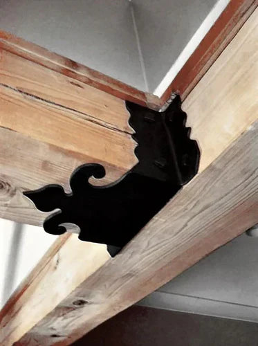 Decorative black joist hanger installed between wooden beams for structural support