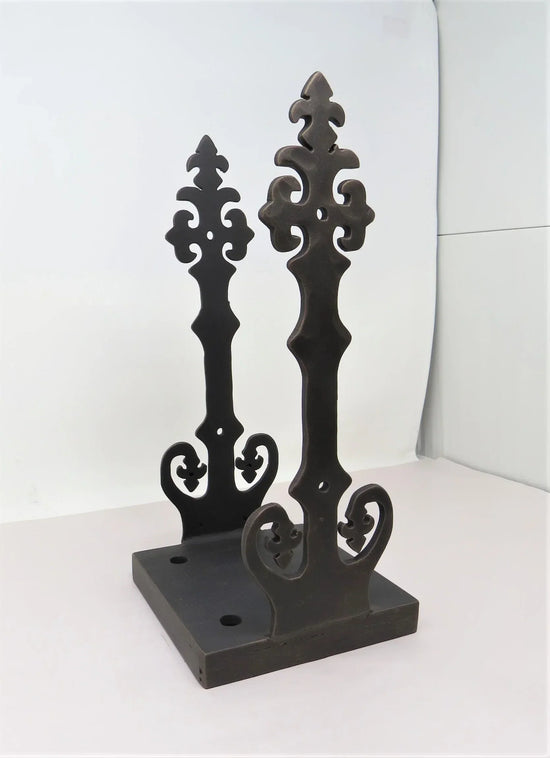 Decorative cast iron post bases featuring intricate scroll designs for home aesthetics