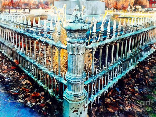 decorative wrought iron fence with intricate details and autumn leaves surrounding it