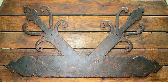 Ornate K plate design showcasing craftsmanship for enhancing home exteriors