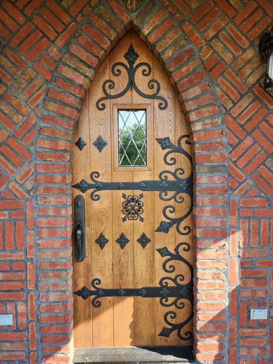 Elegant front door with detailed iron accents, showcasing a classic yet timeless design